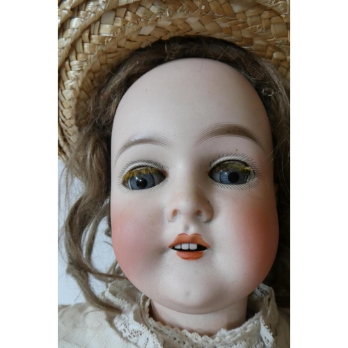 110 - A Queen Louise bisque socket head doll, with blue glass sleeping eyes, open mouth, teeth, wood and c... 