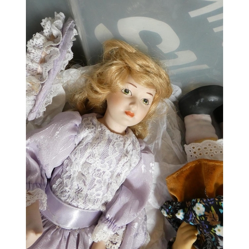 113 - A box of small collectors dolls including a Hummel style doll and all bisque examples (Est. plus 24%... 