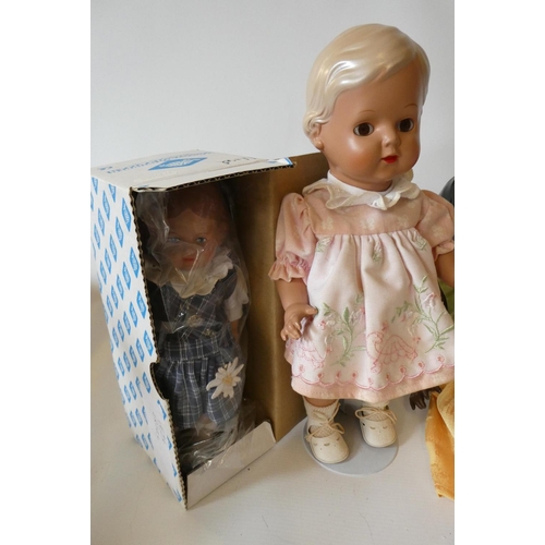 115 - Five Schildkrot-Puppen jointed celluloid dolls, with moulded hair and original outfits, one boxed (E... 