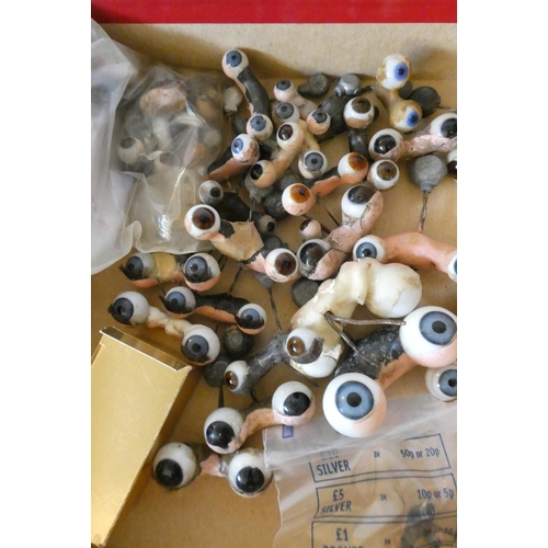 127 - A box of antique and vintage dolls accessories including shoes, socks and glass eyes (Est. plus 24% ... 