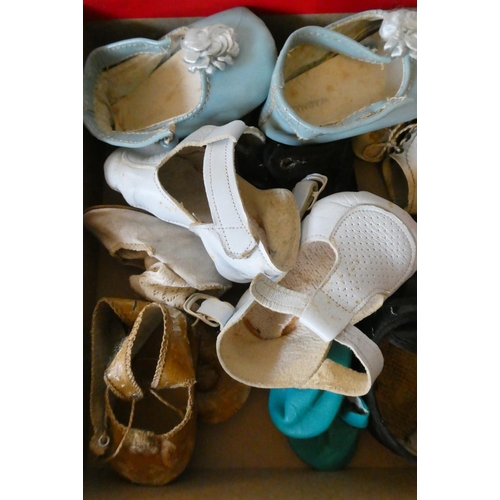 127 - A box of antique and vintage dolls accessories including shoes, socks and glass eyes (Est. plus 24% ... 