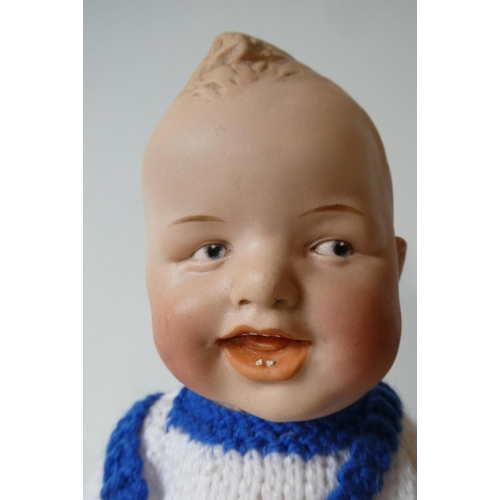 130 - A Heubach bisque socket head character doll, with painted and moulded sideways glancing eyes, moulde... 