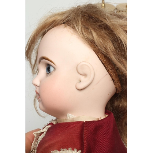 131 - A Tete Jumeau bisque socket head doll, with blue glass fixed eyes, closed mouth, pierced ears, blond... 