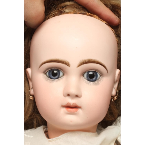 133 - A Bebe Jumeau bisque socket head doll, 1890, with blue glass paperweight fixed eyes, closed mouth, p... 