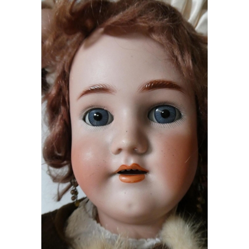 134 - A Max Handwerck Halbig bisque socket head doll, with blue glass sleeping eyes, open mouth, applied t... 