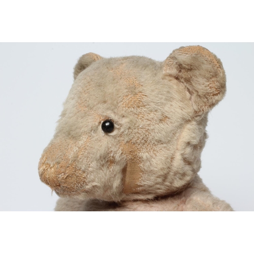 144 - A pre-war pink jointed teddy bear, with shoe button eyes, sewn nose and cloth pads, 16