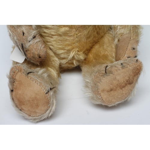 146 - Blond mohair jointed teddy bear, c.1920, with clear glass eyes, sewn nose, large ears and cloth pads... 