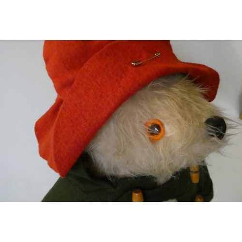 147 - Vintage Paddington bear, with green felt coat, red felt hat, red Dunlop boots and tag, 18