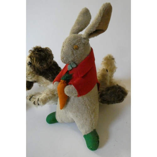 151 - Three vintage plush toys, comprising a Chiltern cat with felt ears and tongue, a puppy pyjama case a... 