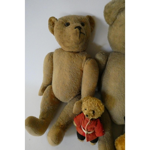 157 - Seven vintage plush toys comprising three large teddy bears, one small soldier bear, two puppets inc... 