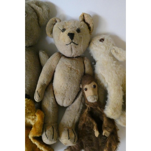 157 - Seven vintage plush toys comprising three large teddy bears, one small soldier bear, two puppets inc... 