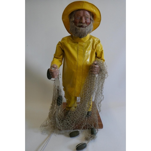 19 - A J. H. Animations automaton of a fisherman with composite hands and face, beard, yellow hat and coa... 