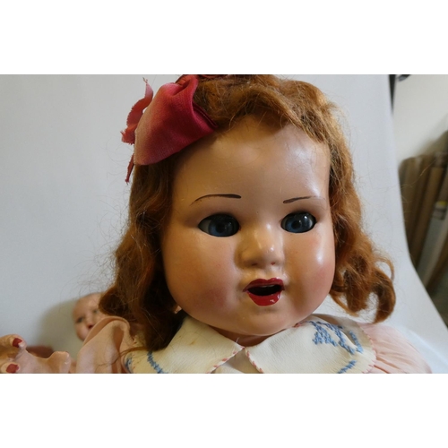 20 - Four vintage dolls, comprising a 23