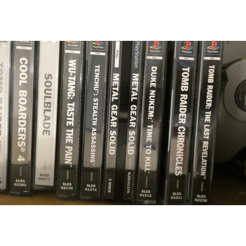 212 - Playstation with controllers and 28 boxed games, including Tomb Raider, Tomb Raider II and III, Tony... 