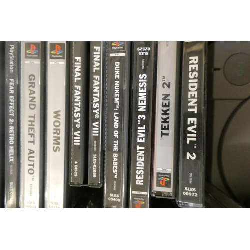 212 - Playstation with controllers and 28 boxed games, including Tomb Raider, Tomb Raider II and III, Tony... 