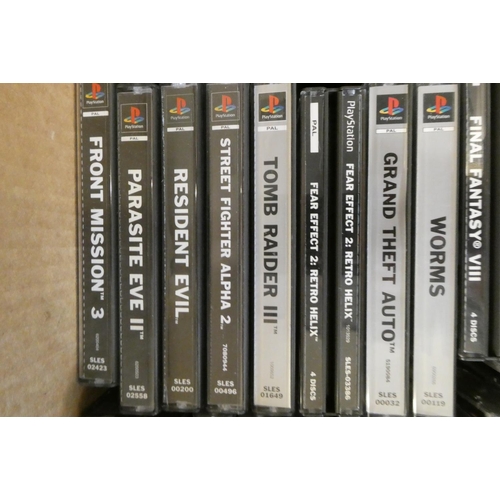 212 - Playstation with controllers and 28 boxed games, including Tomb Raider, Tomb Raider II and III, Tony... 