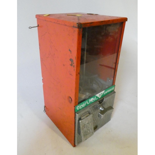 213 - Toy 'n Joy tin plate vending/gum ball machine, reg. 934, 10c pricing, some rust, unable to test func... 