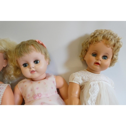 24 - Four vintage vinyl dolls, comprising a 30