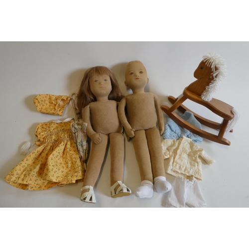 26 - Two vintage Sasha type course dolls, with fabric heads and bodies, painted features and clothing inc... 