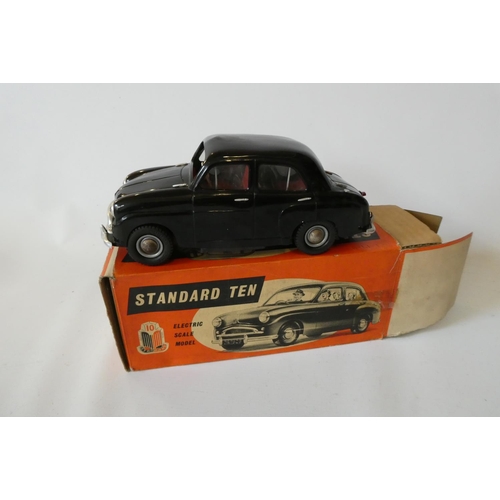 266 - Victory Industries Standard 10 saloon battery operated car, finished in black plastic, some very min... 