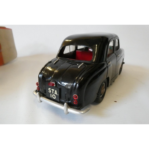 266 - Victory Industries Standard 10 saloon battery operated car, finished in black plastic, some very min... 