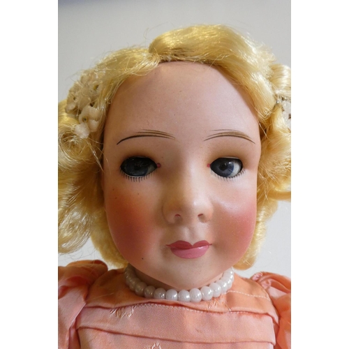 27 - A Unis Jumeau princess doll, 1938, with blue glass sideways glancing eyes, metal sleeping eyelids, c... 