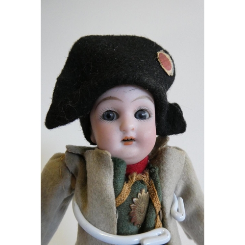 32 - A bisque head Napoleon doll, possibly Franz Schmidt & Co., with blue glass sleeping eyes looking out... 