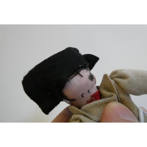 32 - A bisque head Napoleon doll, possibly Franz Schmidt & Co., with blue glass sleeping eyes looking out... 