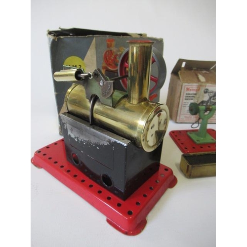 326 - Mamod MM2 spirit fired steam engine, box at fault, model fair and a Mamod grinding stone with poor b... 