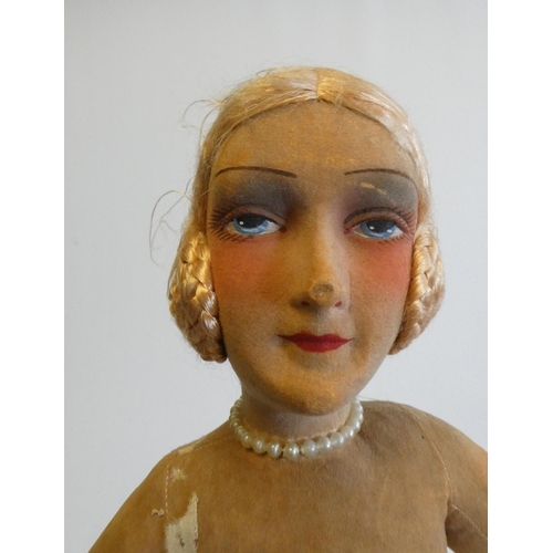 34 - A French cloth Boudoir ballerina doll, 1920s, with painted blue eyes, long lashes, single stroke bro... 