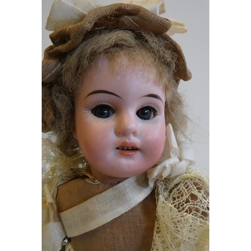 36 - An Armand Marseille bisque socket head doll, with blue glass sleeping eyes, open mouth, teeth, dark ... 