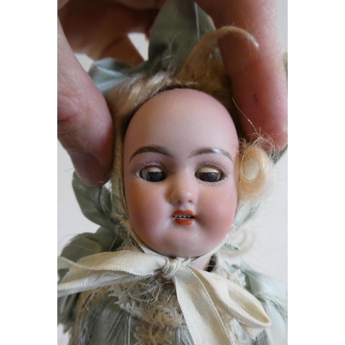 37 - A Simon & Halbig bisque socket head doll with brown glass sleeping eyes, open mouth, teeth, pierced ... 