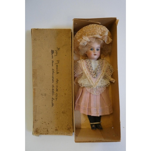 38 - A Theodor Recknagel bisque socket head doll, rare in original box, with blue glass fixed eyes, open ... 