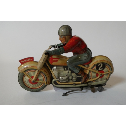 383 - Technofix clockwork motorcycle and rider, some minor paint loss and scratches, clockwork motor worki... 