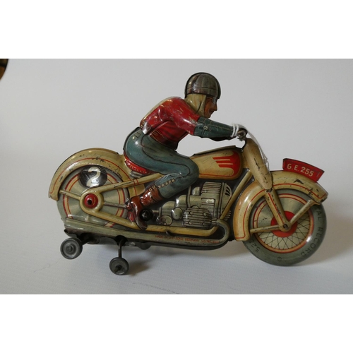 383 - Technofix clockwork motorcycle and rider, some minor paint loss and scratches, clockwork motor worki... 