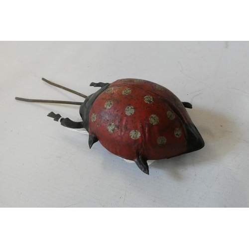 387 - Gunthermann clockwork powered ladybird beetle, three legs damaged, some rusting to body work (Est. p... 