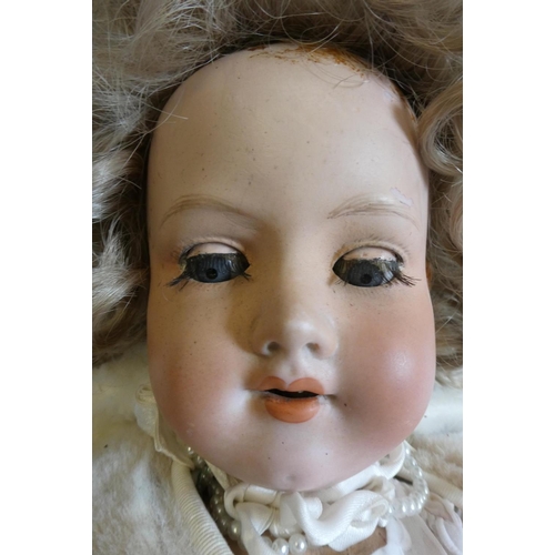 4 - Three vintage dolls, comprising a 24