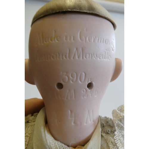 43 - An Armand Marseille bisque socket head doll with blue glass sleeping eyes, open mouth, teeth, blond ... 