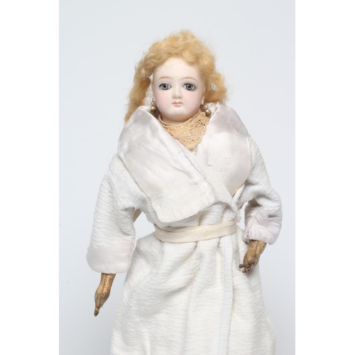 46 - A French bisque swivel neck shoulder head fashion doll, possibly Jumeau, with blue glass fixed eyes,... 