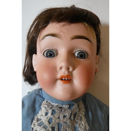 52 - A Max Handwerck bisque socket head doll, with blue glass sleeping eyes, open mouth, teeth, brown wig... 