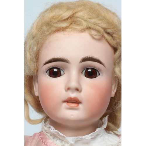 54 - A Belton type doll, with brown glass fixed eyes, closed mouth, pierced ears, blond wig, wood and com... 