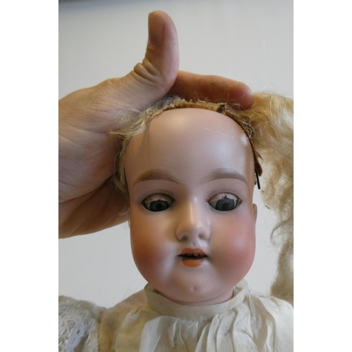 55 - An Armand Marseille bisque socket head doll with blue glass sleeping eyes, open mouth, teeth, blond ... 