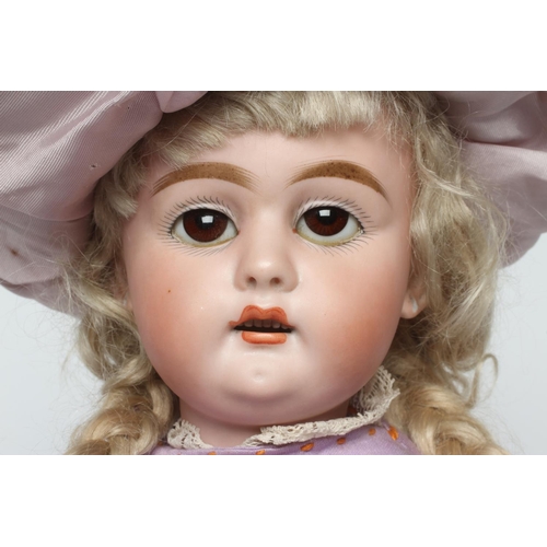 56 - A bisque socket head doll, with brown glass sleeping eyes, open mouth, teeth, pierced ears, blond wi... 