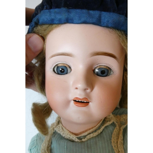 60 - A German bisque socket head doll, with blue glass sleeping eyes, open mouth, teeth, pierced ears, bl... 