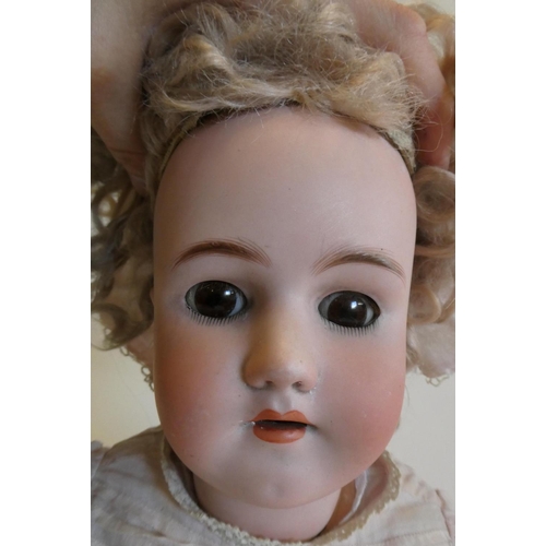 61 - A Heinrich Handwerck Simon & Halbig bisque socket head doll with brown glass sleeping eyes, open mou... 