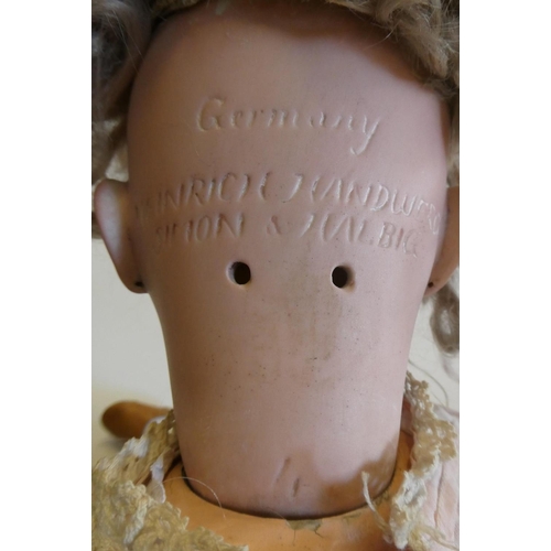 61 - A Heinrich Handwerck Simon & Halbig bisque socket head doll with brown glass sleeping eyes, open mou... 