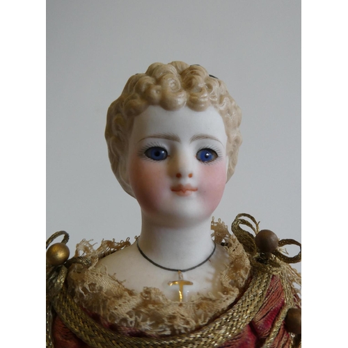 63 - A rare late Victorian bisque shoulder head fortune doll with blue glass fixed eyes, moulded blond ha... 