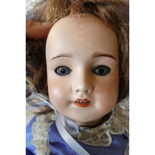 66 - A UNIS of France bisque socket head doll, with blue glass sleeping eyes, open mouth, teeth, brown wi... 