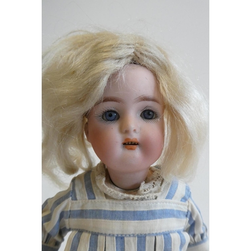 68 - A Kammer & Reinhardt Halbig bisque socket head doll, with blue glass sleeping eyes, open mouth, teet... 