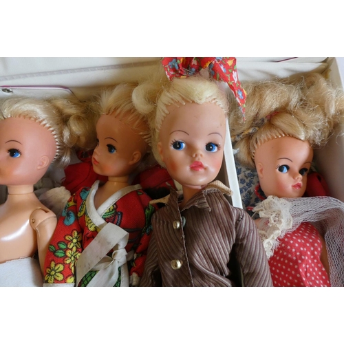 7 - Seven Sindy dolls with two carrying cases and a quantity of clothing, together with another doll by ... 